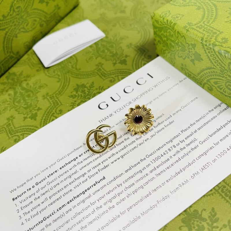 G*u*i earrings